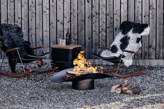 Höfats fire pit with cow print chairs
