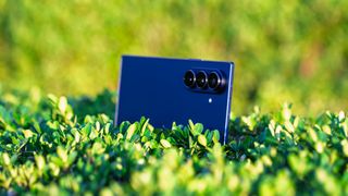 Samsung Galaxy Z Fold 7 propped up on a bush