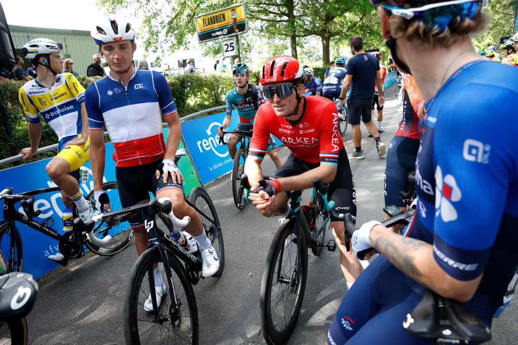 BILZEN BELGIUM AUGUST 27 LR Valentin Madouas of France Arnaud Dmare of France And Team ArkaSamsic and the peloton stopped at the finish line to protest as riders deem the course as being too dangerous during the 19th Renewi Tour 2023 Stage 5 a 1873km stage from Riemst to Bilzen UCIWT on August 27 2023 in Bilzen Belgium Photo by Bas CzerwinskiGetty Images