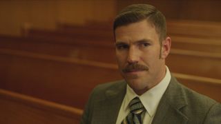 Austin Stowell as Pete Welsh in a courtroom in A Friend of the Family