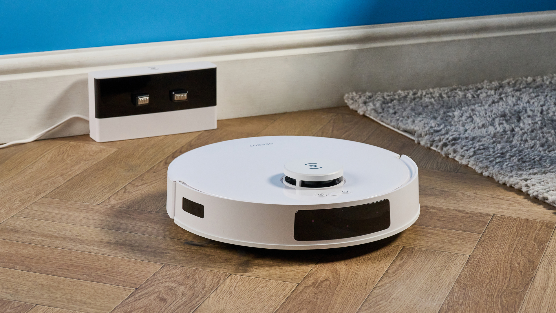 Ecovacs Deebot N20 in white photographed vacuuming floor