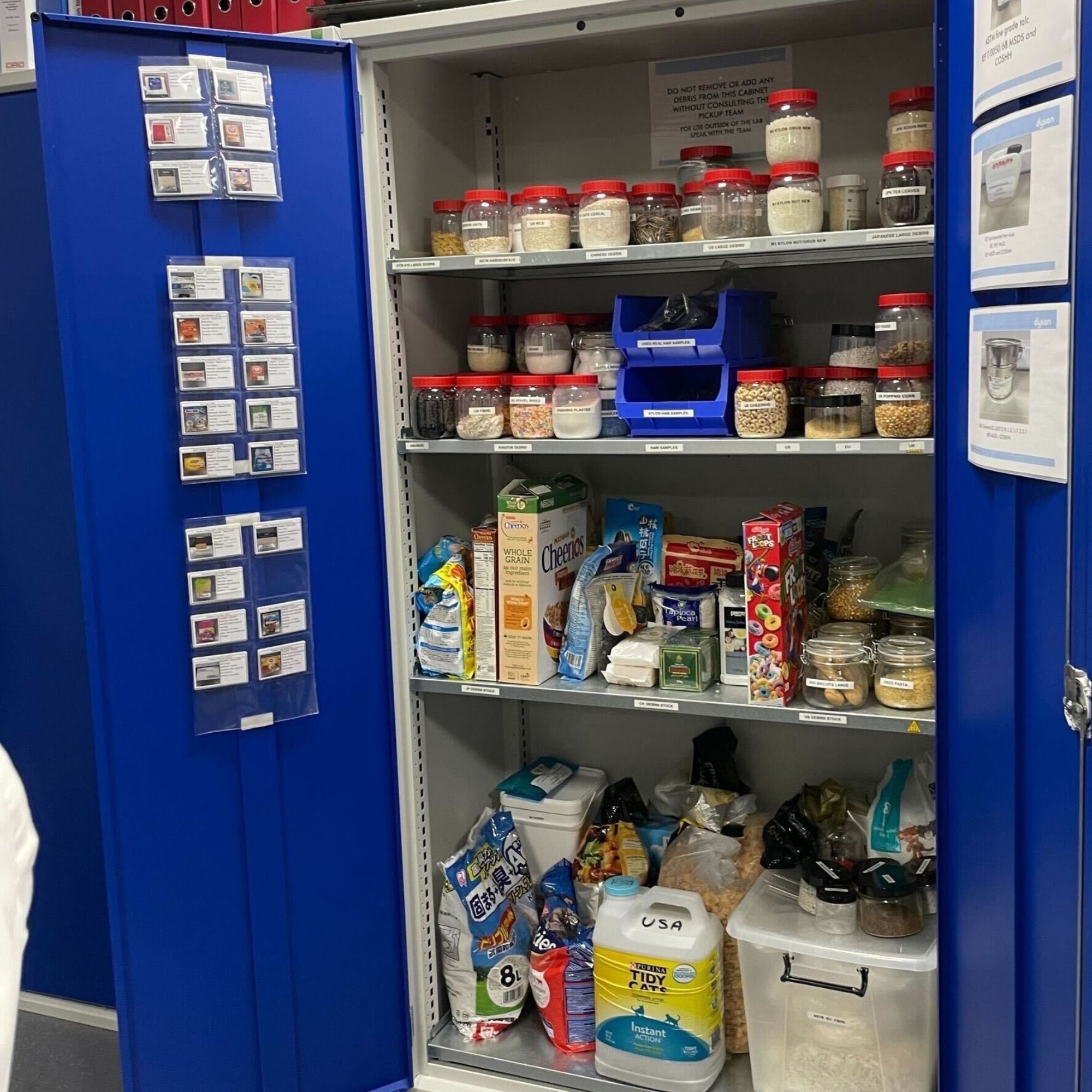Blue cupboard filled with different debris