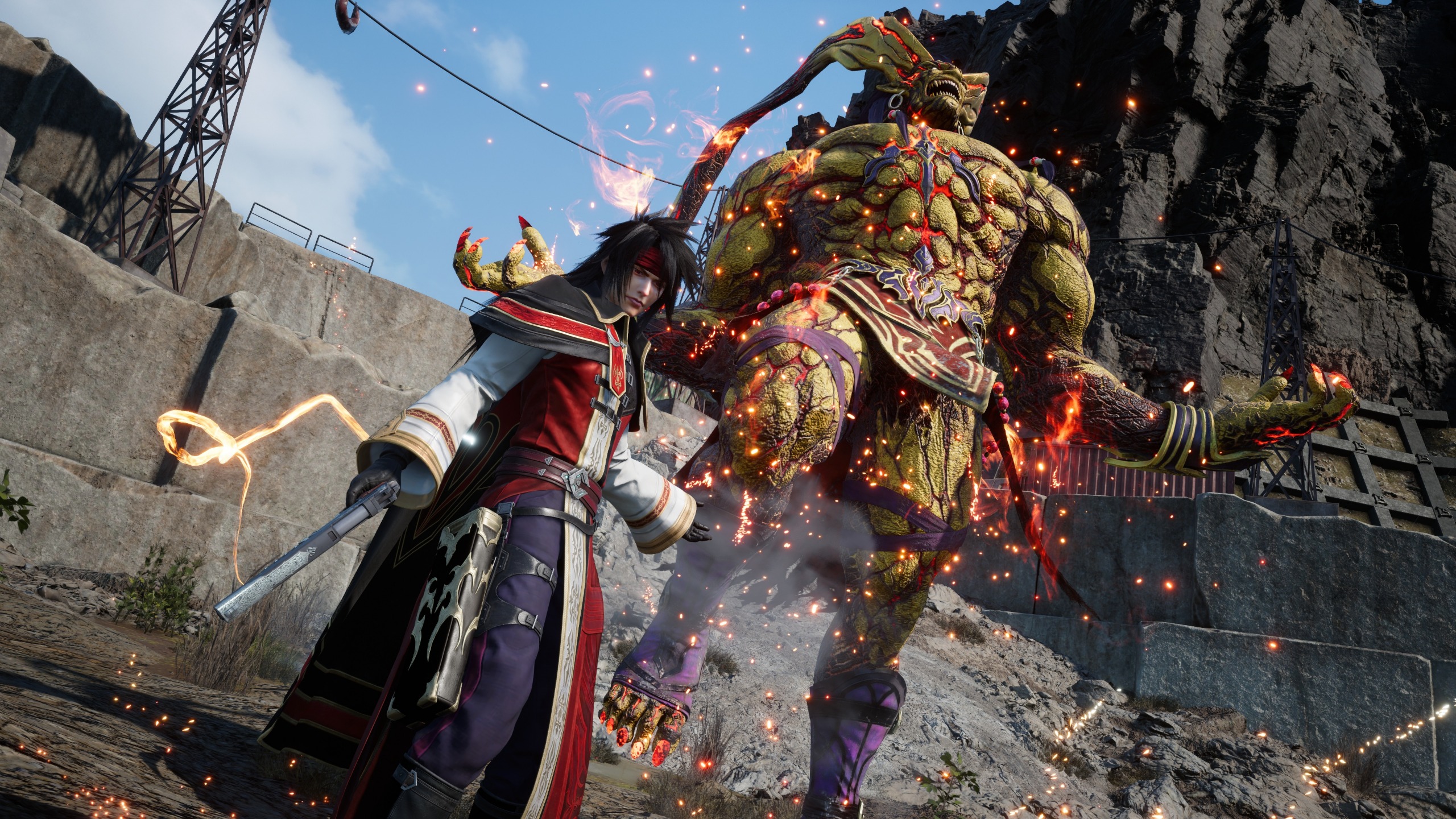 A dark-haired warrior in a red and black coat stands beside a large, muscular, golden-skinned monster amidst floating embers in a rocky landscape.