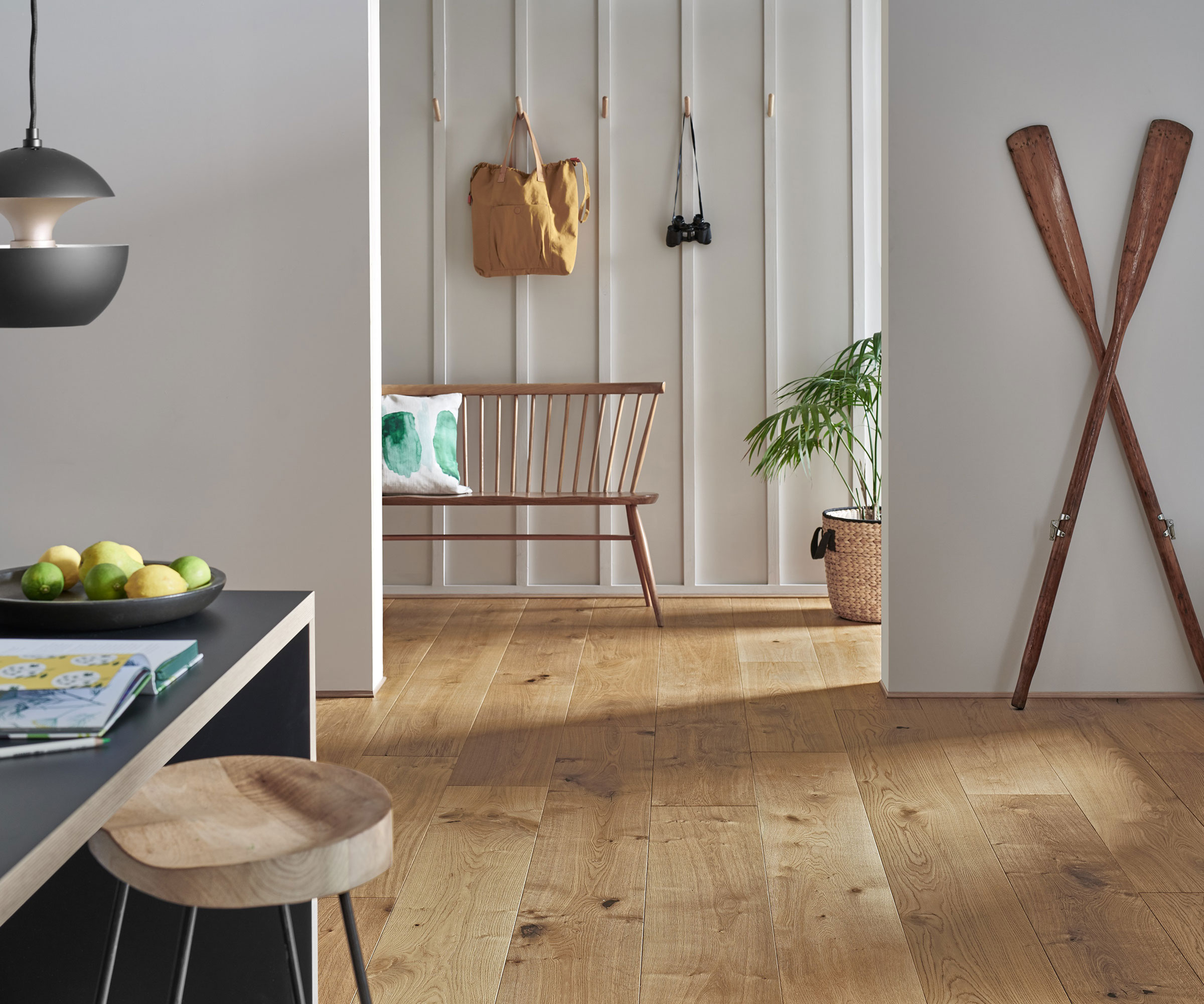 oak wide plank engineered wooden flooring in kitchen leading to hallway