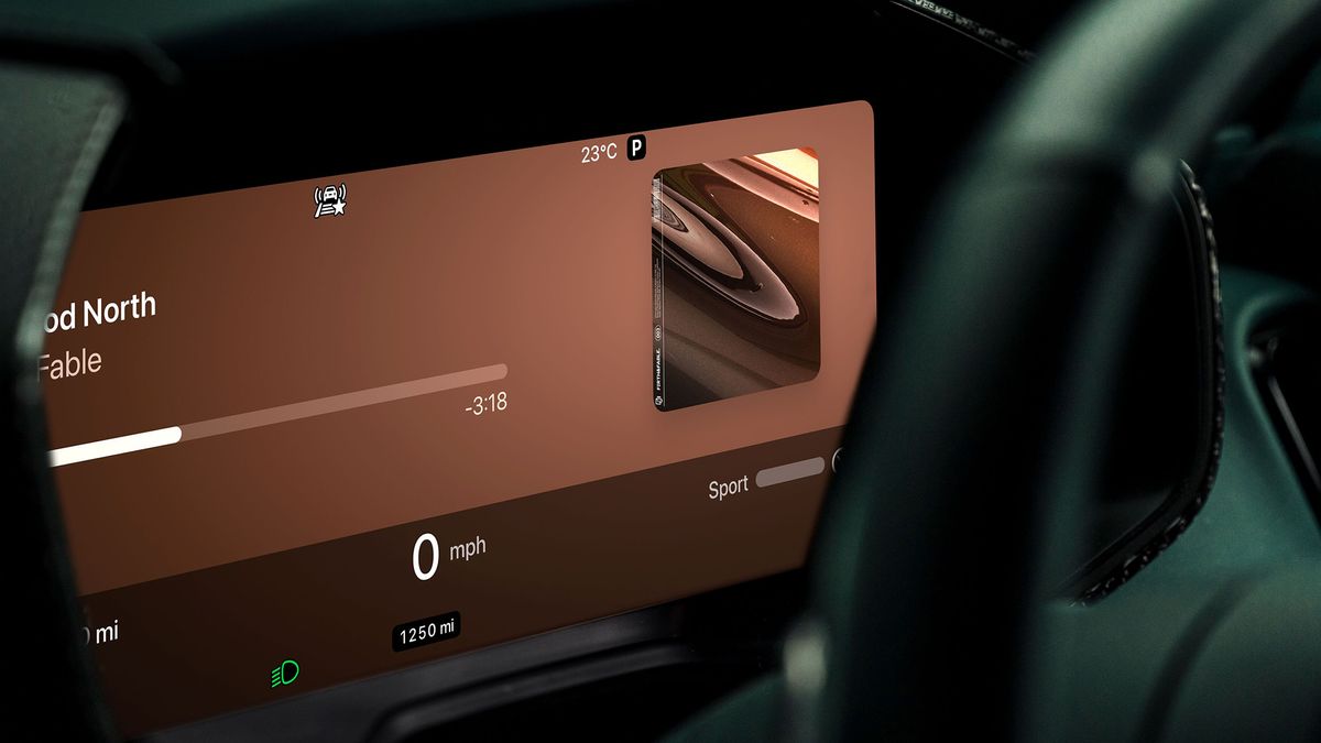 The interior of an Aston Martin car showing Apple CarPlay Ultra