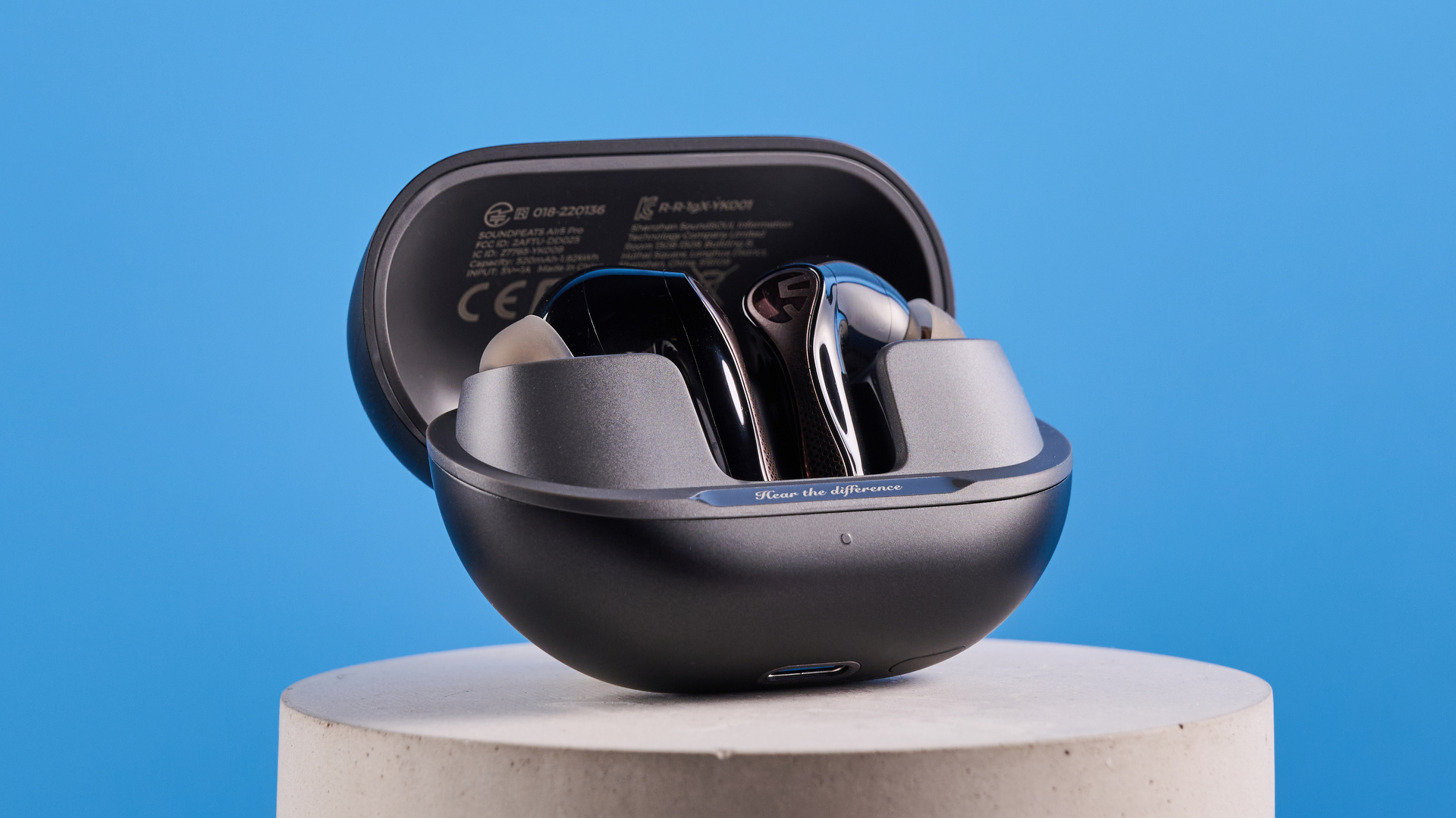 the soundpeats air5 pro earbuds in black and bronze with a black charging case and ear tips