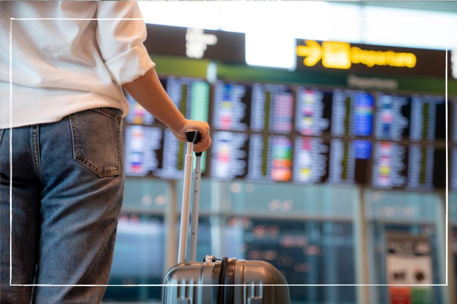 a woman waiting at an airport due to flight cancellations