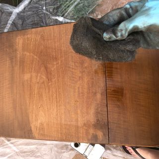using steel wool and varnish stripper to clean old wooden furniture