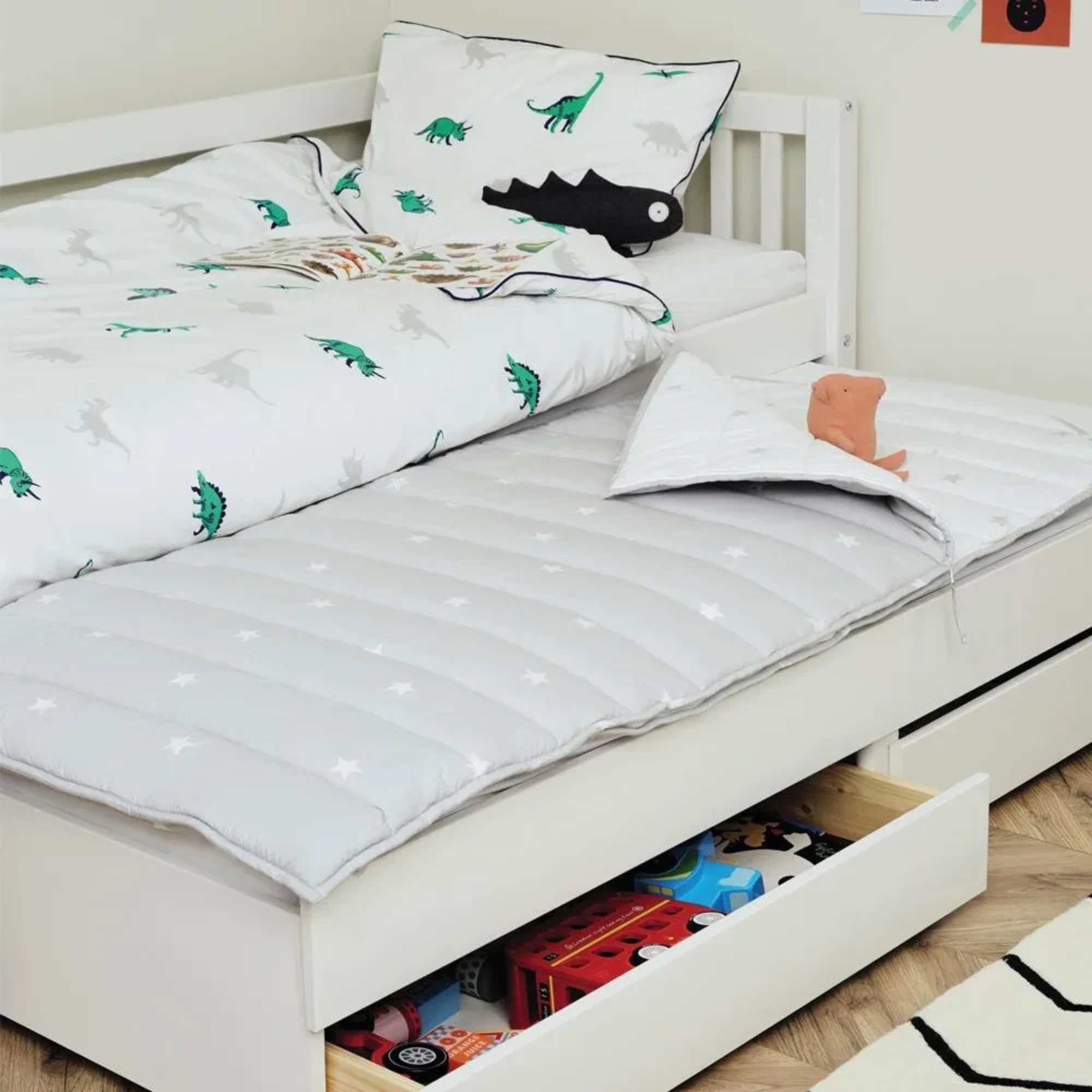 a single kids bed with storage and truckle bed 