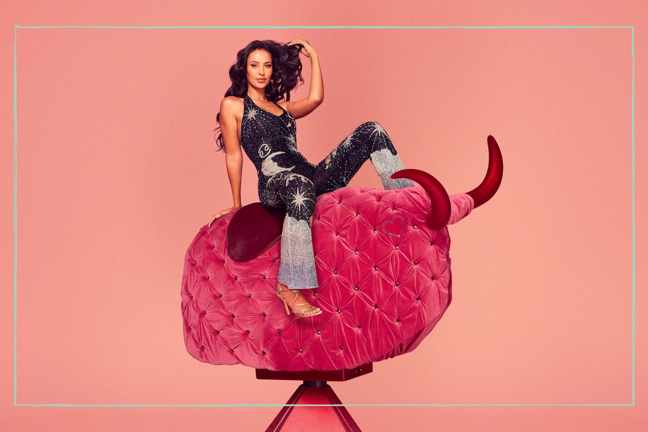 a close up of Maya Jama posing on a pink mechanical bull to promote Winter Love Island