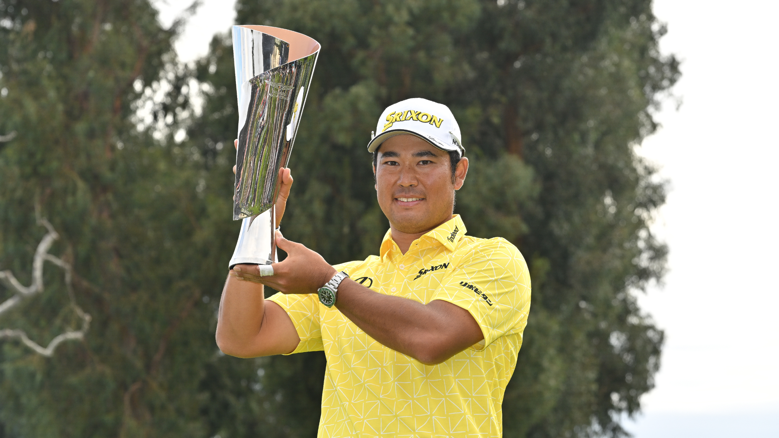 Hideki Matsuyama with the Genesis Invitational trophy