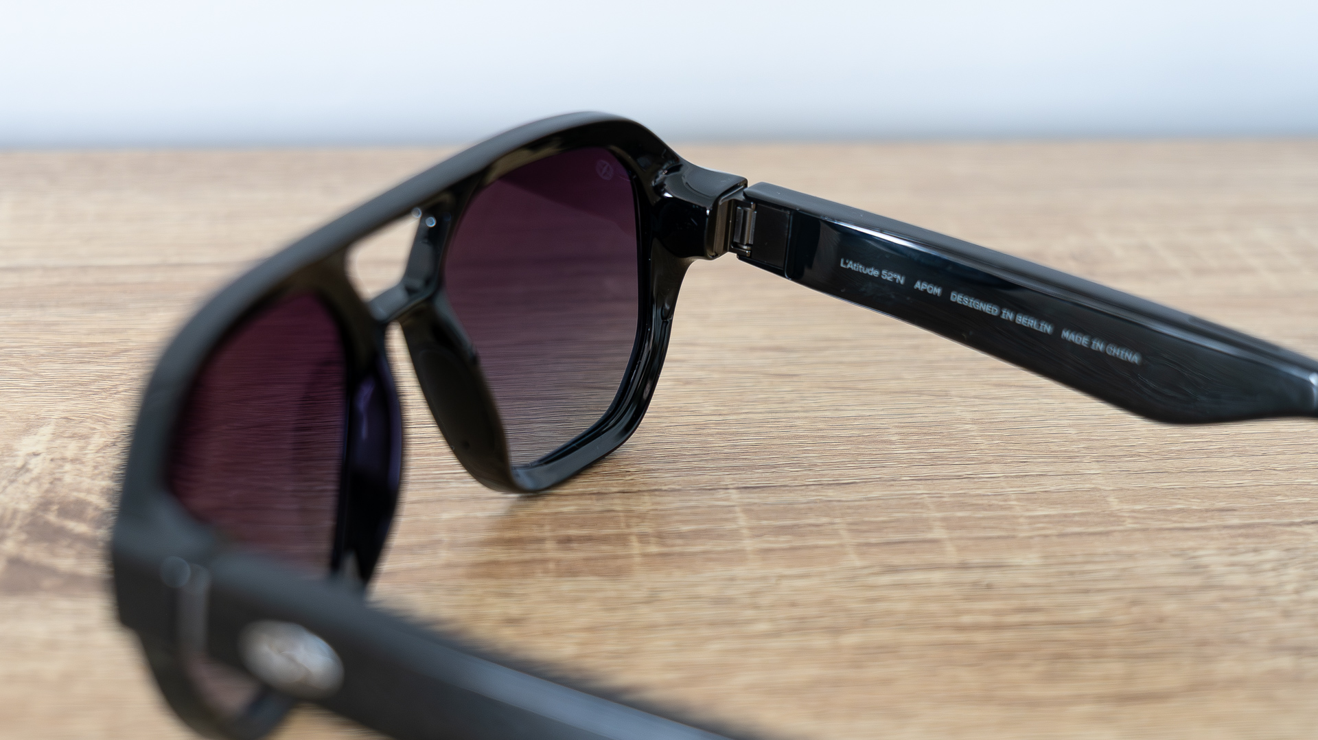 L'Atitude 52&amp;deg;N Smart Glasses review images, in case, on a sideboard and worn outside