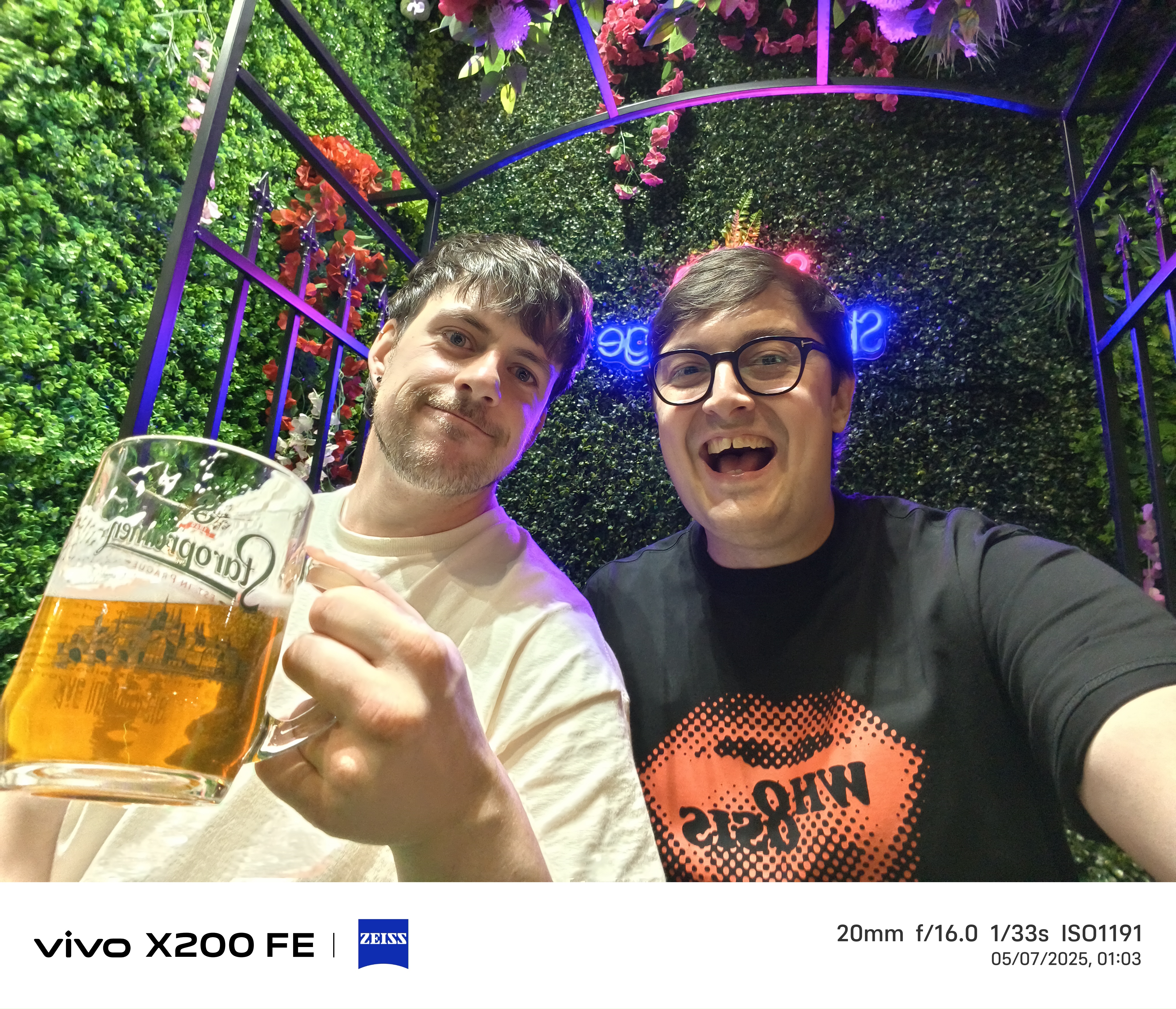 Selfie of two friends, having a drink