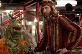 Nicholas Braun as jim henson and one of his muppets in saturday night