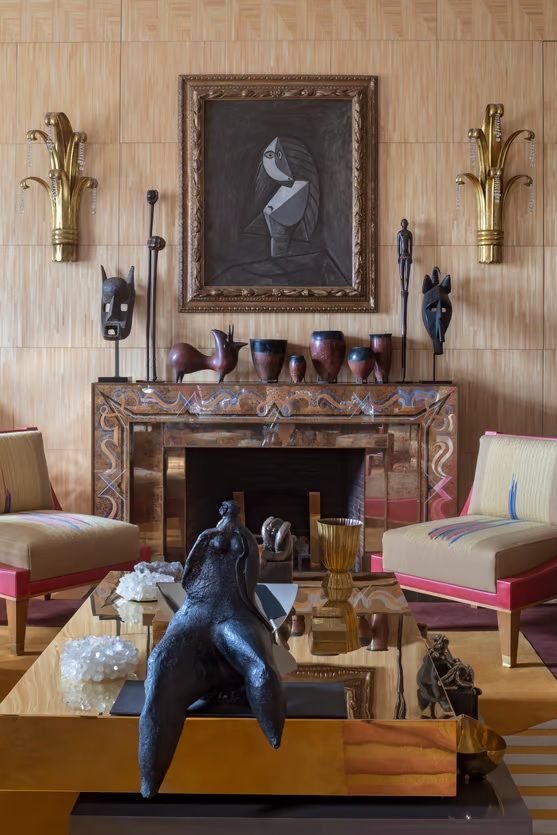 A series of eccentrically decorated rooms features organic shaded sculptures, modern furniture, and art with a sumptuous feel.
