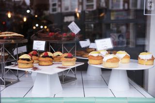 Cakes on stands on a store window