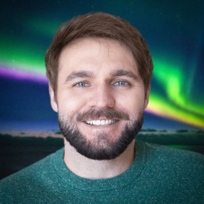 Tom Kerss profile photo in front of aurora borealis