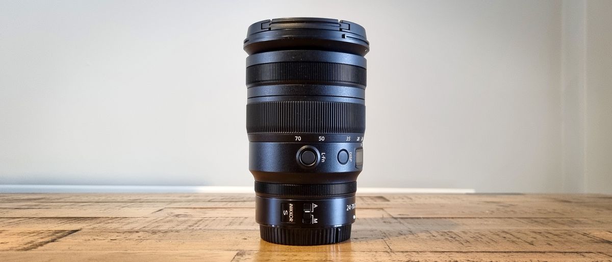 Product image of the lens on a wooden table