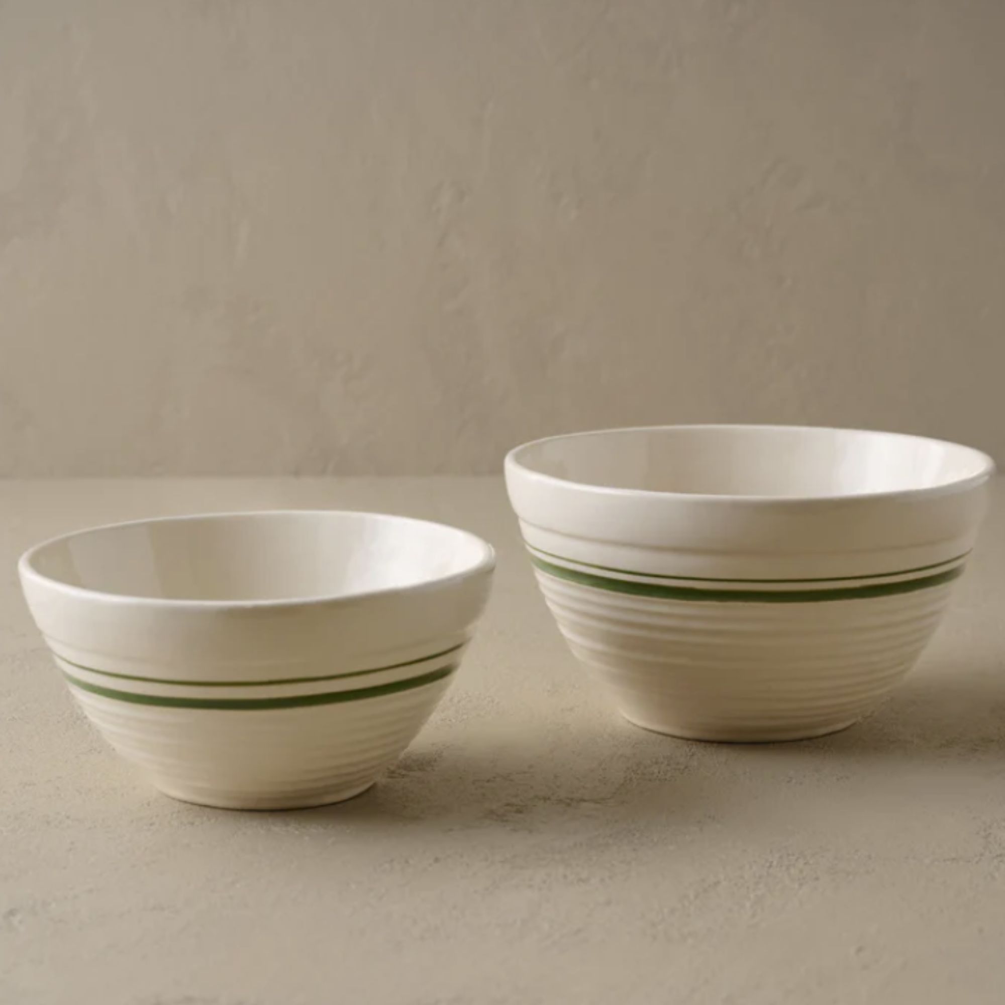 White ceramic mixing bowls with green stripe