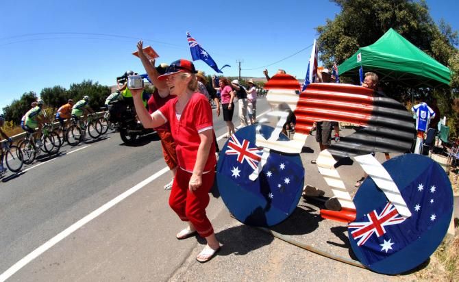 Fans cheer on the peloton