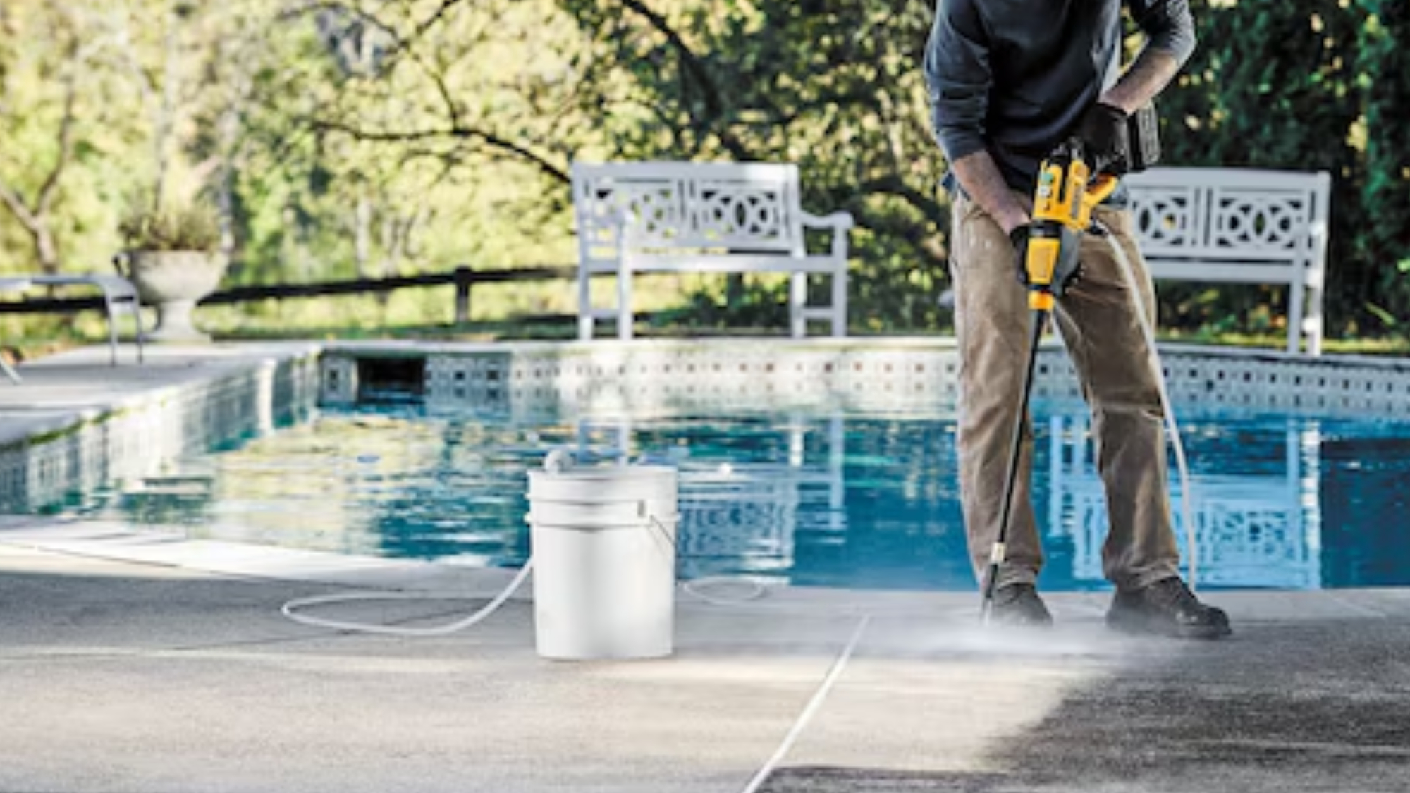 Cleaning concrete with Dewalt cordless pressure washer