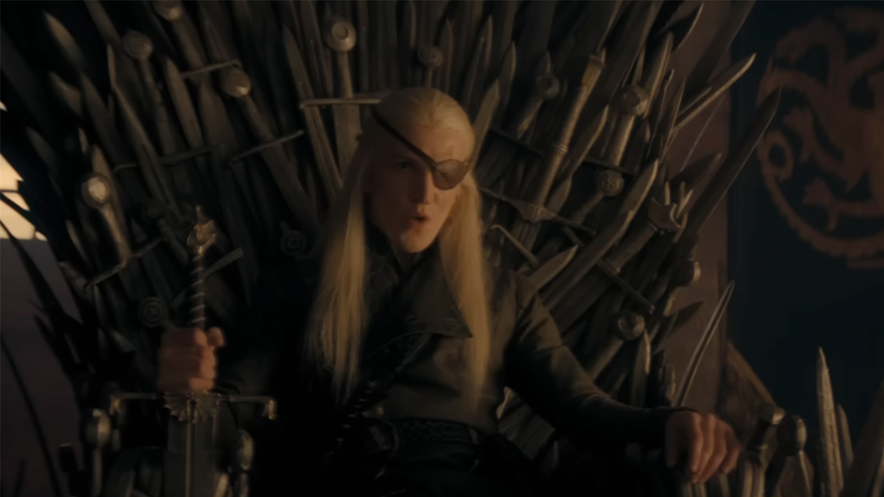 Ewan Mitchell sitting on the Iron Throne in House of the Dragon