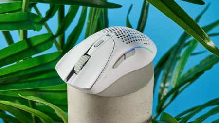 A white Glorious Model D2 wireless gaming mouse with a perforated design