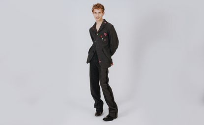 Model wears suit by Horace Page