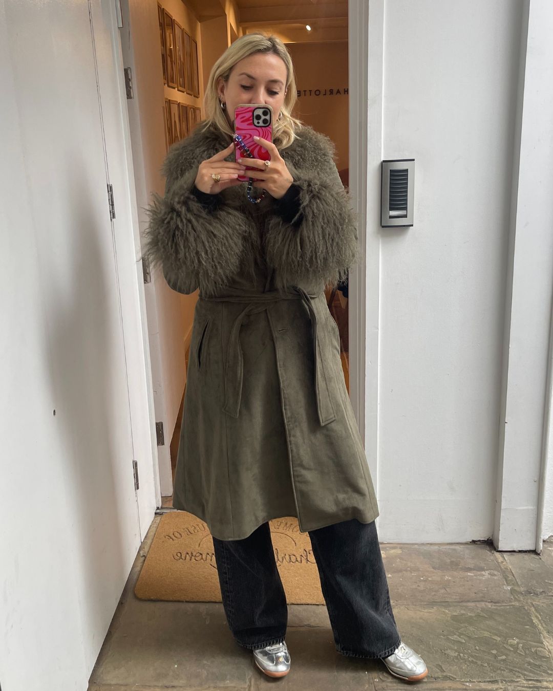 Clementina Jackson tries on the charlotte simone penny coat