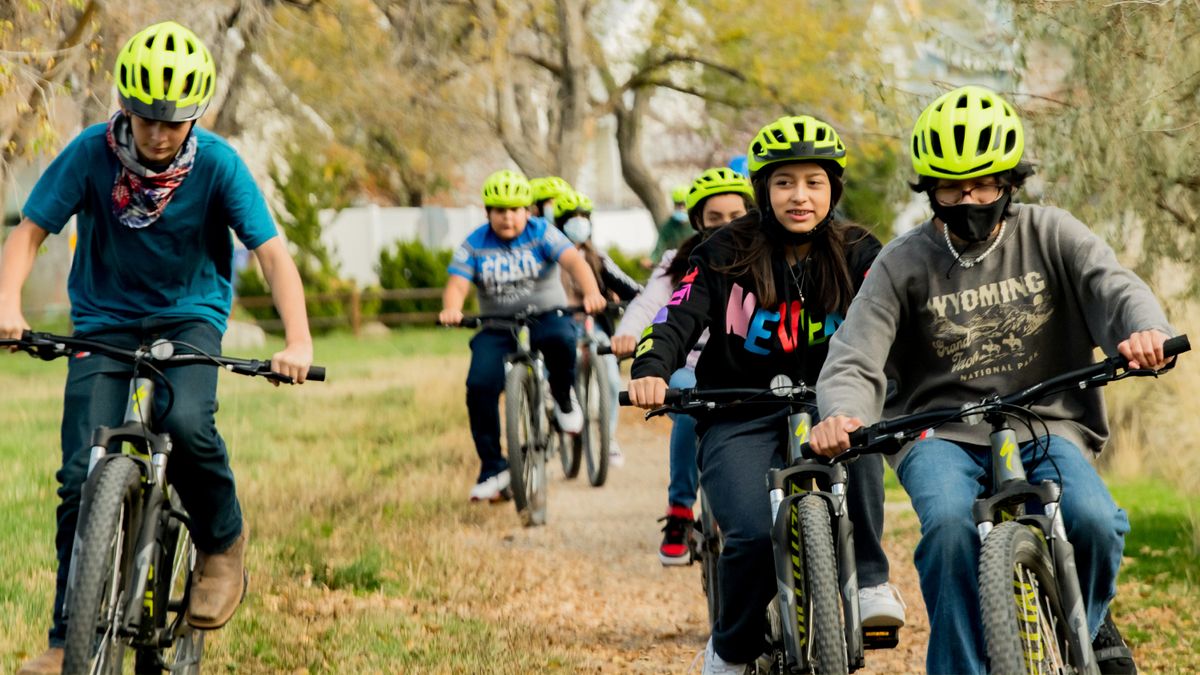 A group of kids on mountain bikes