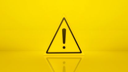 A yellow triangular hazard sign with an exclamation mark in the middle.