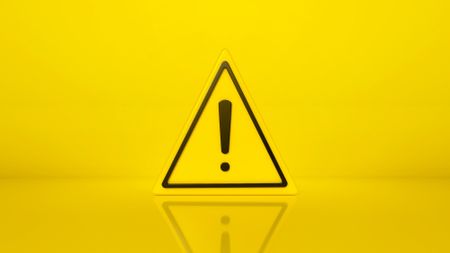 A yellow triangular hazard sign with an exclamation mark in the middle.