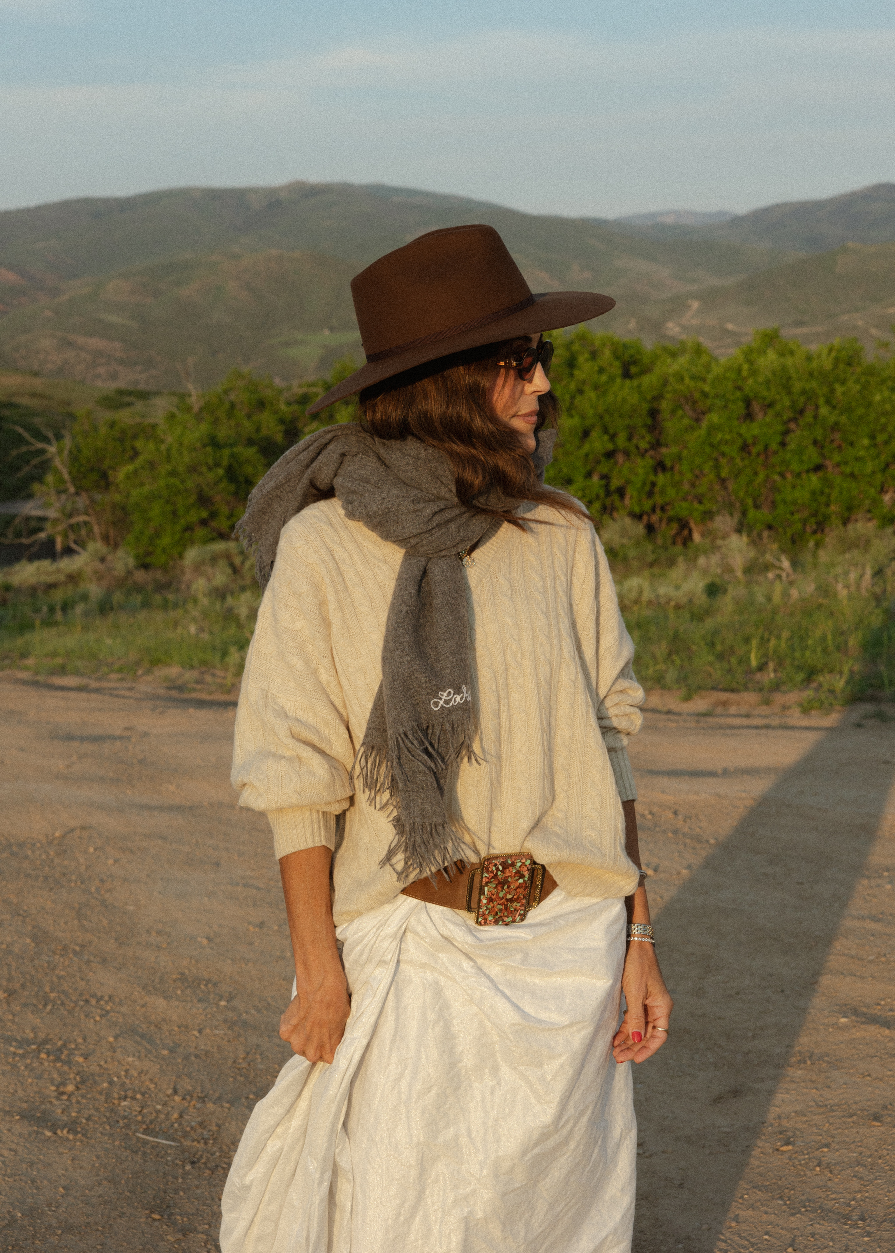 Larissa Mills wearing a knit scarf around her neck