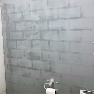 bathroom wall before makeover