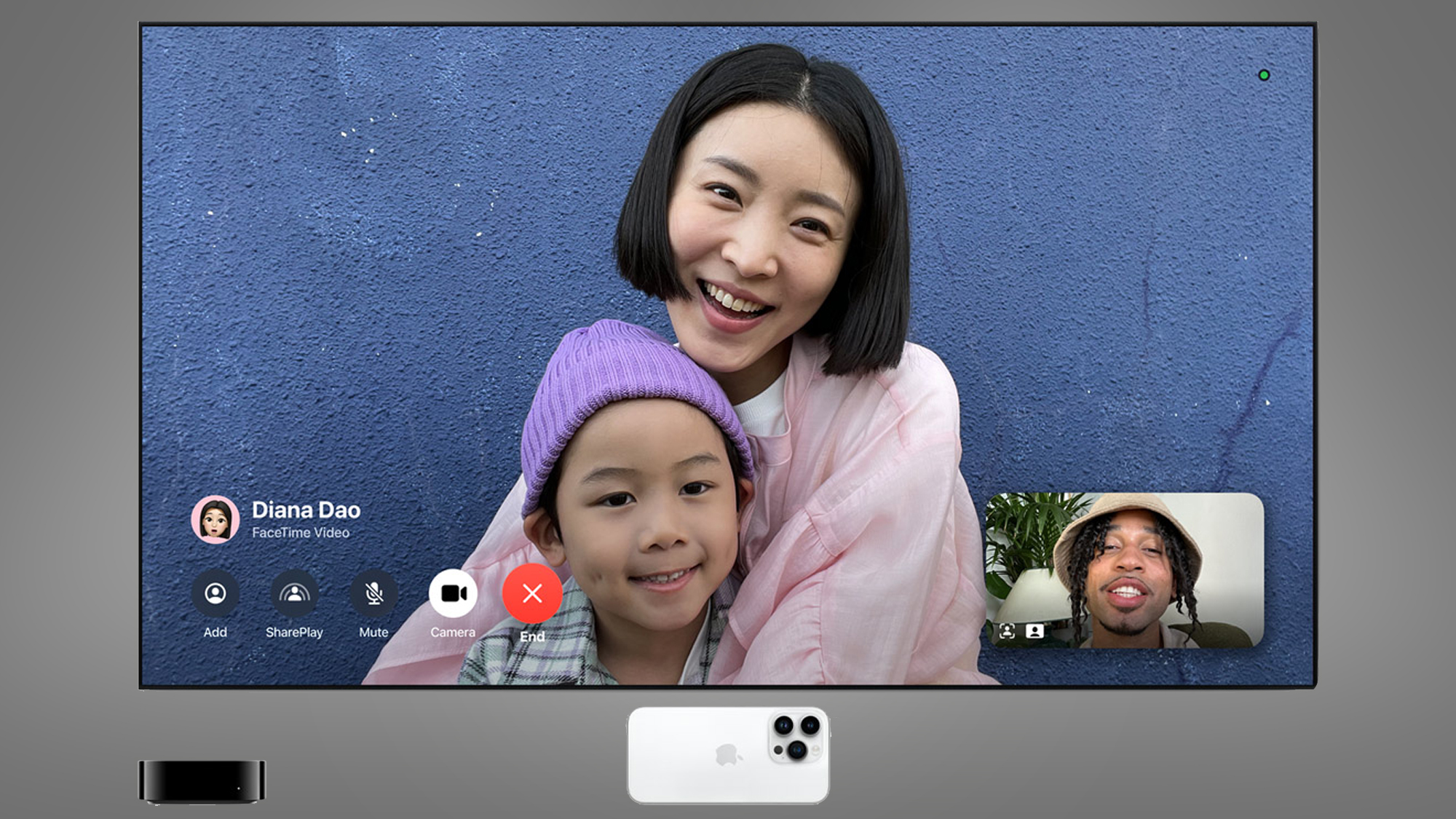 A mother and child in a FaceTime call on a TV screen