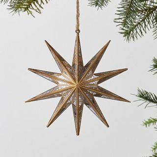 Mirrored Star Ornament on a tree.
