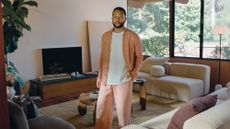 John Legend standing in a living room