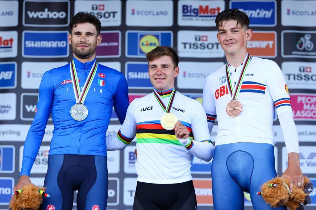 Silver medallist Italian Filippo Ganna gold medallist Belgian Remco Evenepoel and bronze medallist British Josh Tarling pictured on the podium after the elite men time trial race at the UCI World Championships Cycling in Glasgow Scotland Friday 11 August 2023 UCI organizes the worlds with all cycling disciplines road cycling indoor cycling mountain bike BMX racing road paracycling and indoor paracycling in Glasgow from 03 to 13 August BELGA PHOTO DAVID PINTENS Photo by DAVID PINTENS BELGA MAG Belga via AFP Photo by DAVID PINTENSBELGA MAGAFP via Getty Images