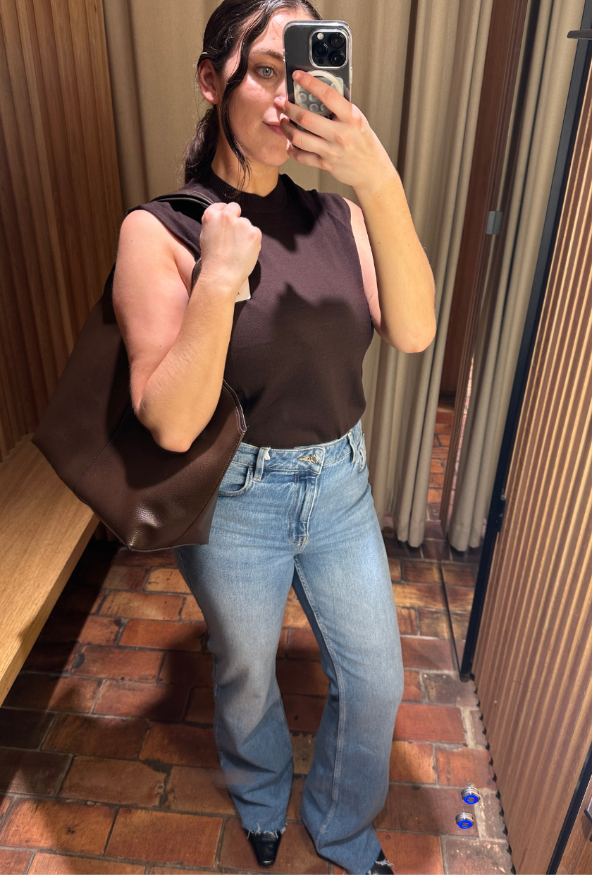An image of Who What Wear UK SEO Writer, Ava Gilchrist, wearing Mango bootcut jeans.