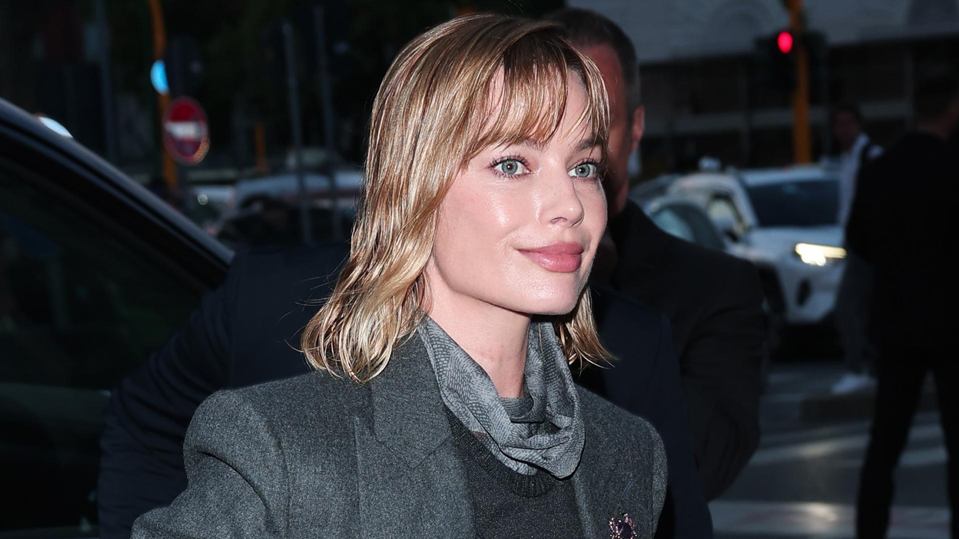 Margot Robbie wore a layered spring look from Armani to an event in Milan