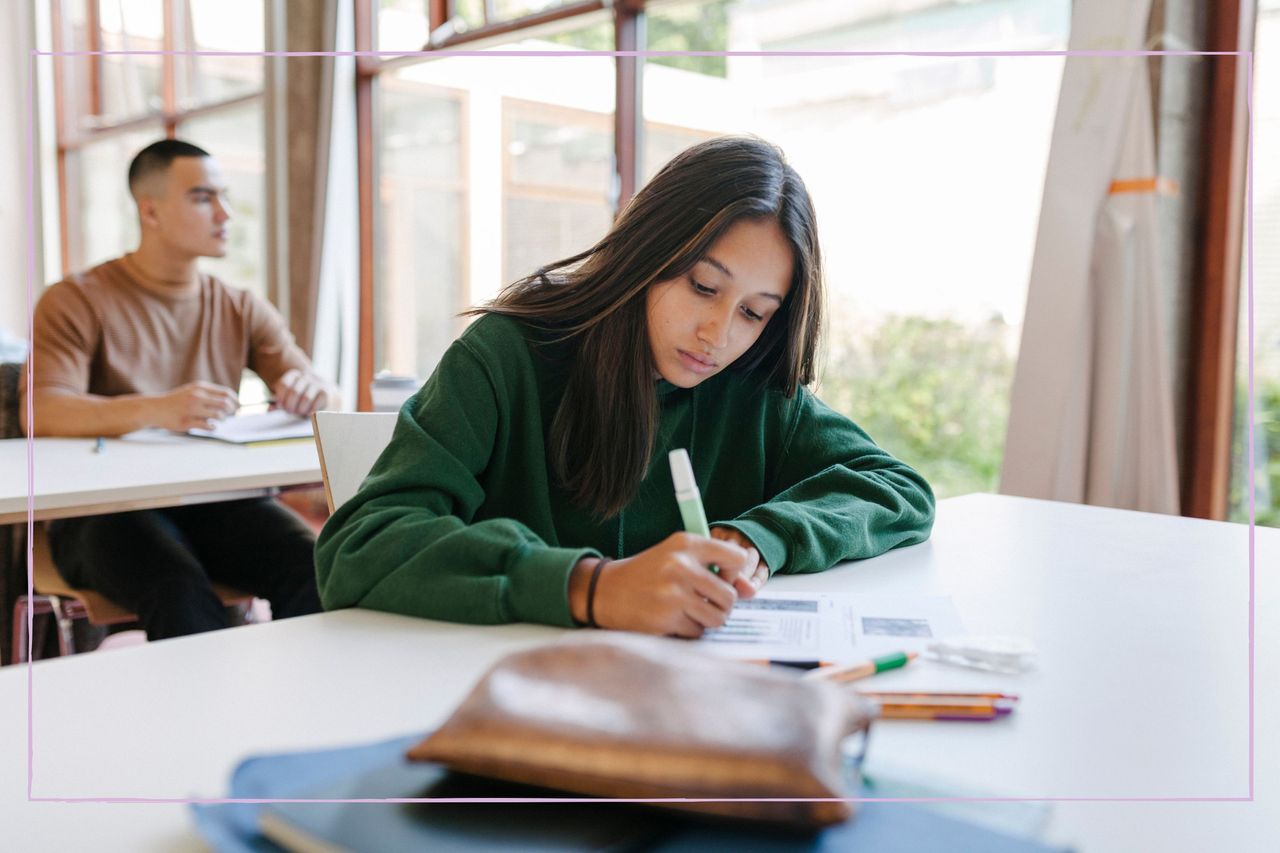 A young girls taking an exam in a classroom