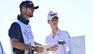 Nelly Korda chats to her caddie during the 2024 LPGA Drive On Championship