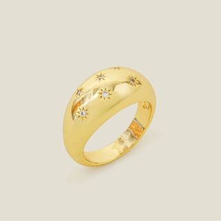 flat lay image of gold ring 