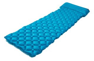 A blue sleeping pad for camping