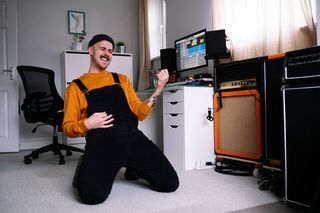Man playing air guitar in his home studio