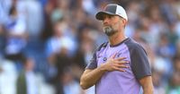 Liverpool manager Jurgen Klopp acknowledges the fans following the Premier League match between Brighton & Hove Albion and Liverpool FC at American Express Community Stadium on October 08, 2023 in Brighton, England.