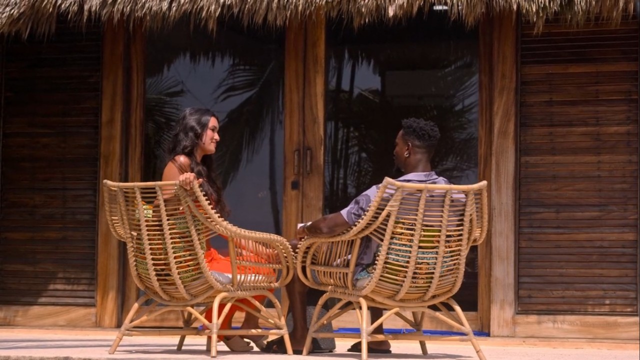 Yamen Sanders and Natalie Cruz looking at each other in Perfect Match.