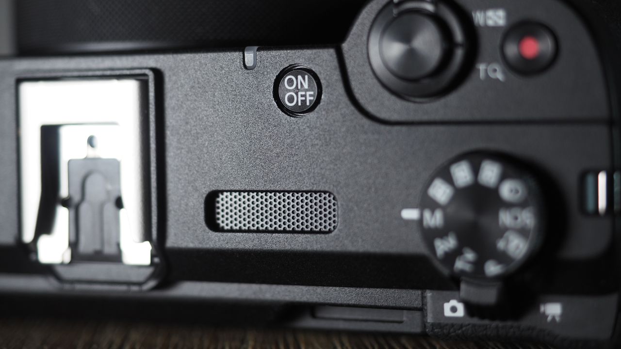 Canon PowerShot V1 on a wooden surface