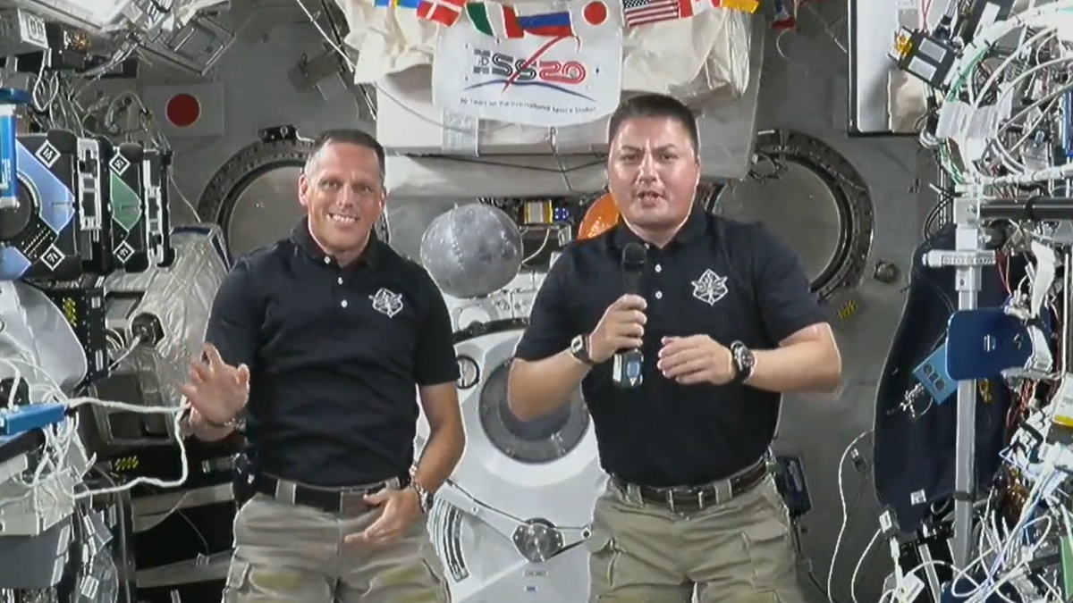 NASA astronauts Bob Hines (left) and Kjell Lindgren deliver an Independence Day message from the International Space Station on July 4, 2022.