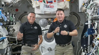 NASA astronauts Bob Hines (left) and Kjell Lindgren deliver an Independence Day message from the International Space Station on July 4, 2022.